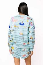 Load image into Gallery viewer, Dogs Swimming on Floats Sweatshirt in Blue
